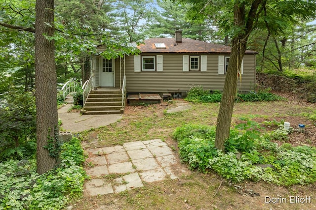 7985 Island View Dr, Newaygo, MI 49337 - back of property featuring a chimney