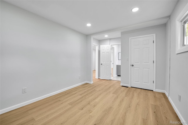 134 W Auburn Rd, Rochester, MI 48307 - unfurnished bedroom featuring recessed lighting, light wood-type flooring, and connected bathroom