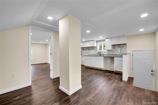 134 W Auburn Rd, Rochester, MI 48307 - kitchen with dark wood-type flooring, white cabinetry, decorative backsplash, recessed lighting, and light stone countertops