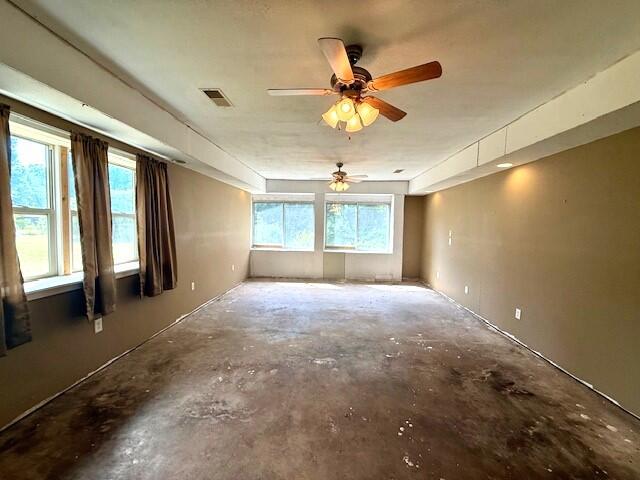 4807 118th Ave, Fennville, MI 49408 - empty room featuring a ceiling fan and unfinished concrete flooring