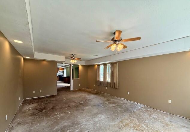 4807 118th Ave, Fennville, MI 49408 - unfurnished room featuring a ceiling fan and unfinished concrete flooring