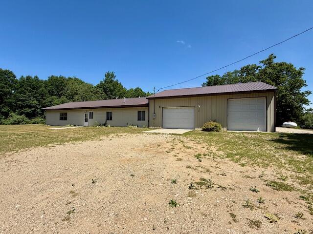 4807 118th Ave, Fennville, MI 49408 - view of home's exterior featuring a garage
