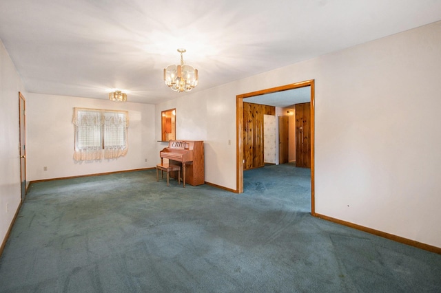 712 N Rath Ave, Ludington, MI 49431 - carpeted spare room featuring a chandelier and baseboards