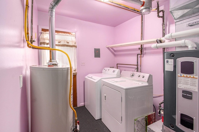712 N Rath Ave, Ludington, MI 49431 - laundry area with gas water heater, water heater, and washing machine and dryer