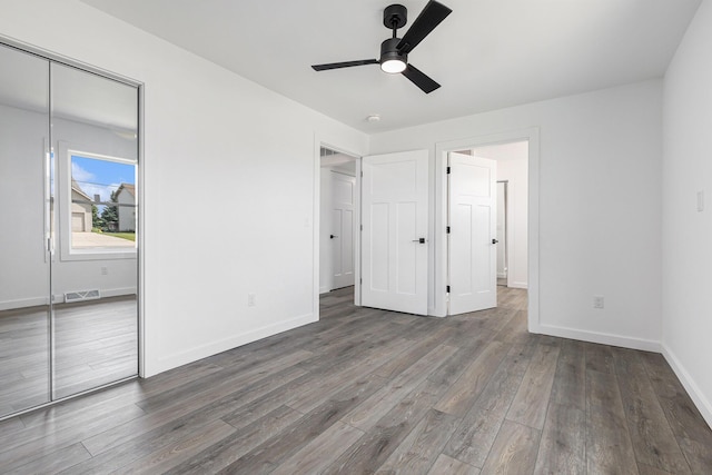 287 Somerset Dr, Brooklyn, MI 49230 - unfurnished bedroom featuring wood finished floors and ceiling fan
