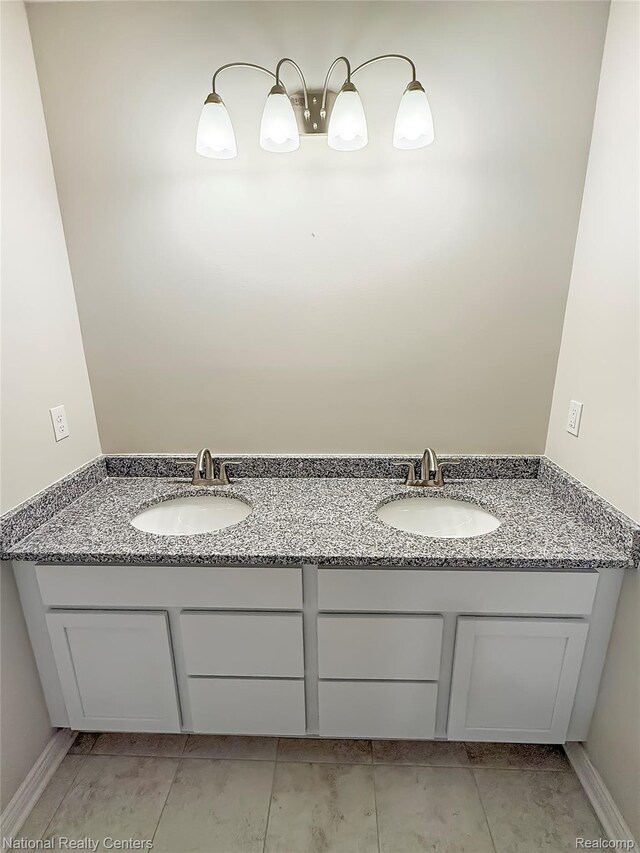 281 Devonshire Dr Unit 6, Lapeer, MI 48446 - bathroom with double vanity and tile patterned flooring