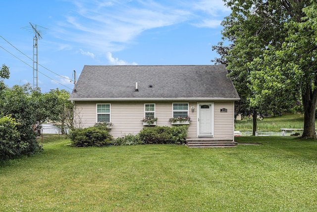 210 Oak Grove Dr, Brooklyn, MI 49230 - back of property featuring a lawn and a shingled roof