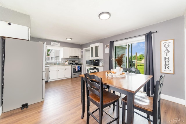 14079 Elms Rd, Montrose, MI 48457 - dining space with light wood-type flooring and plenty of natural light