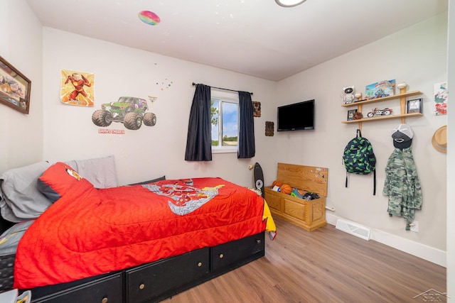 14079 Elms Rd, Montrose, MI 48457 - bedroom featuring wood finished floors and baseboards