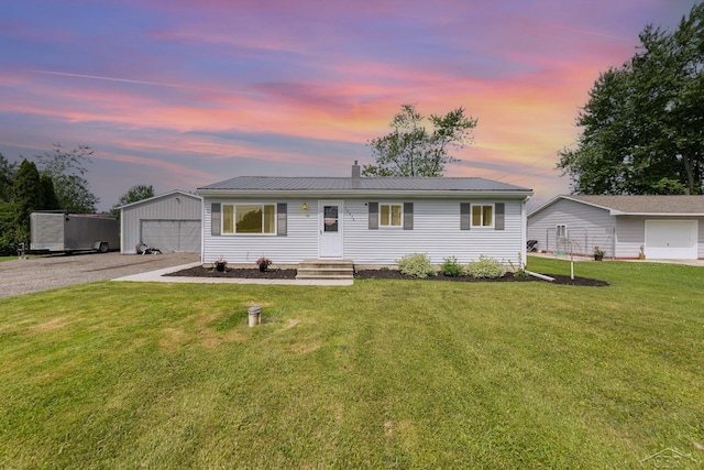 14079 Elms Rd, Montrose, MI 48457 - single story home with an outdoor structure, a yard, a metal roof, a detached garage, and a chimney