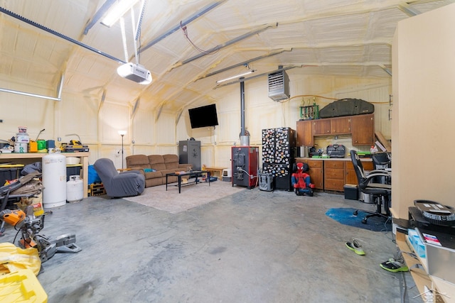 14079 Elms Rd, Montrose, MI 48457 - garage featuring a garage door opener and a heating unit