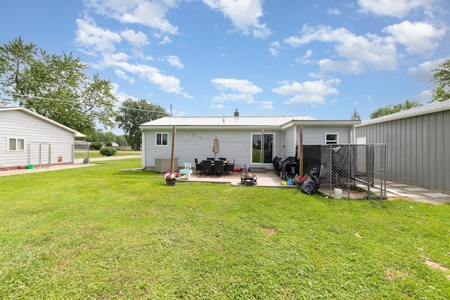 14079 Elms Rd, Montrose, MI 48457 - back of house featuring a patio area and a metal roof