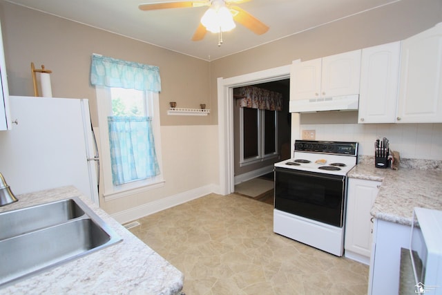 6257 E Dunbar Rd, Monroe, MI 48161 - kitchen with white appliances, under cabinet range hood, white cabinets, light countertops, and decorative backsplash