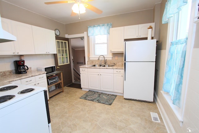 6257 E Dunbar Rd, Monroe, MI 48161 - kitchen with white appliances, a ceiling fan, white cabinets, and extractor fan