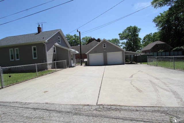 6257 E Dunbar Rd, Monroe, MI 48161 - view of property exterior featuring a detached garage and an outdoor structure