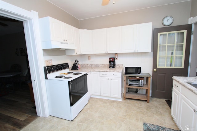 6257 E Dunbar Rd, Monroe, MI 48161 - kitchen featuring white electric stove, under cabinet range hood, black microwave, a ceiling fan, and white cabinetry