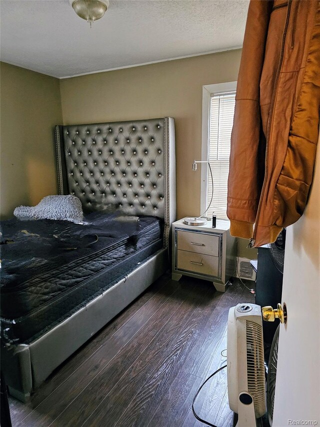 19356 Huntington Rd, Detroit, MI 48219 - bedroom with dark wood-style flooring
