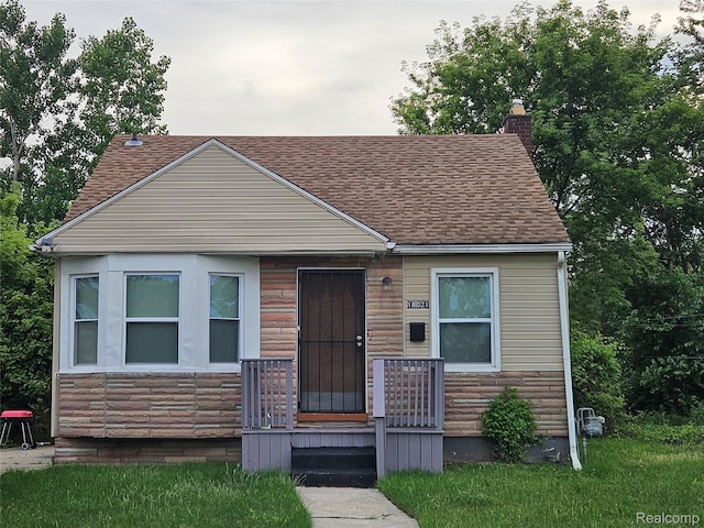 18021 Ferguson St, Detroit, MI 48235 - bungalow-style house with roof with shingles and a chimney