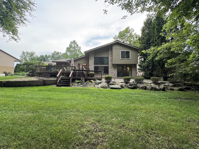 28902 Creek Bend Dr, Farmington Hills, MI 48331 - back of house with a deck, brick siding, and a lawn