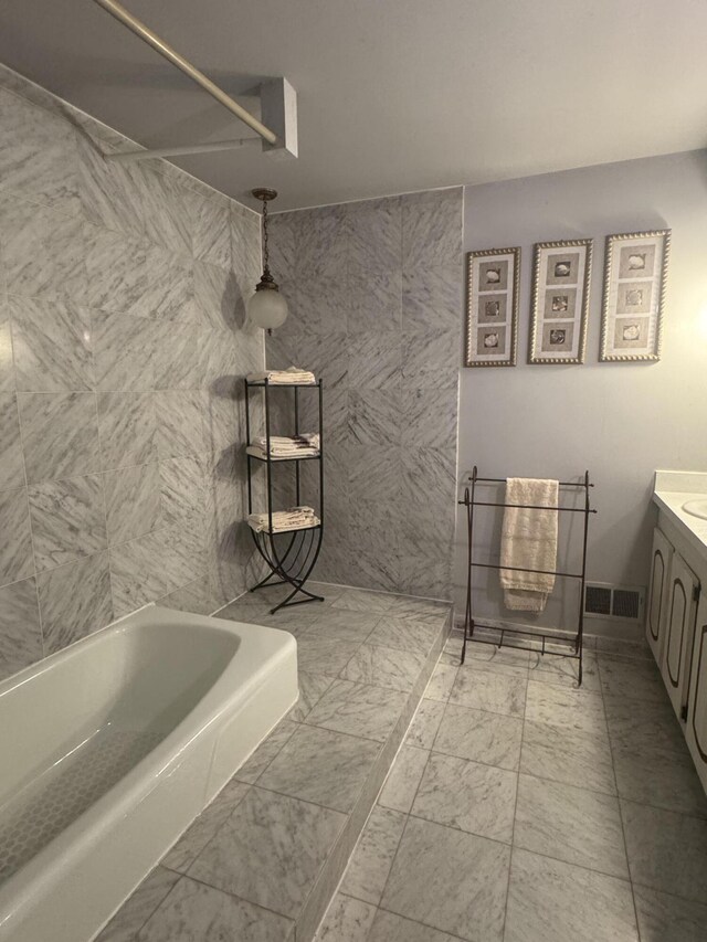 28902 Creek Bend Dr, Farmington Hills, MI 48331 - full bathroom with vanity and marble look tiles