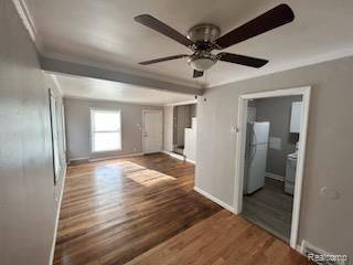 15452 Southfield Rd, Detroit, MI 48223 - unfurnished living room featuring ornamental molding, a ceiling fan, and wood finished floors