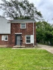 15452 Southfield Rd, Detroit, MI 48223 - view of front facade with a front yard and brick siding