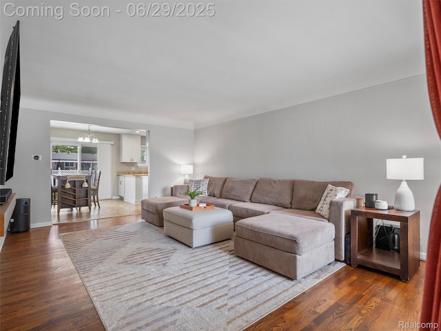 29553 Pinto Dr, Warren, MI 48093 - living room featuring wood finished floors and a chandelier