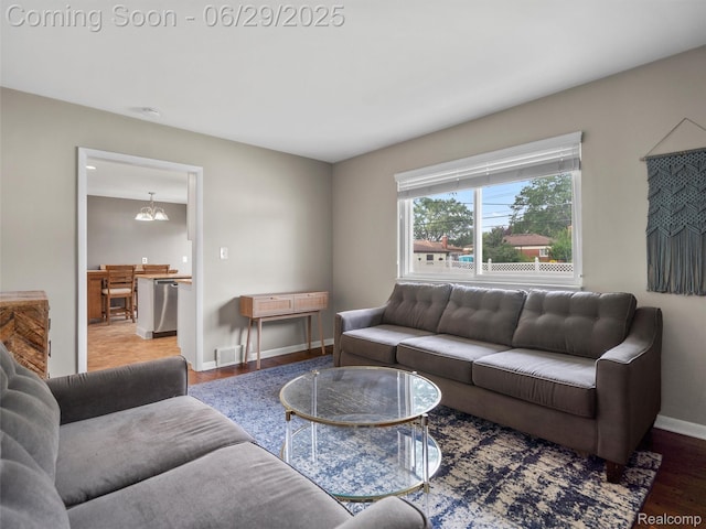 29553 Pinto Dr, Warren, MI 48093 - living room featuring baseboards and wood finished floors