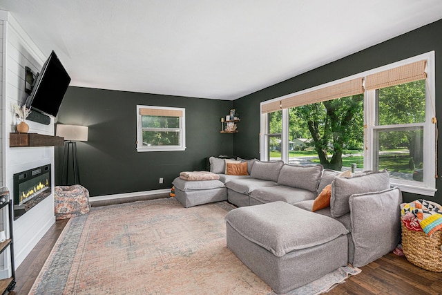 3042 Kevin St, Saint Joseph, MI 49085 - living room with wood finished floors and a glass covered fireplace