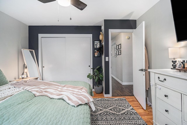 3042 Kevin St, Saint Joseph, MI 49085 - bedroom with a closet, light wood-type flooring, and a ceiling fan