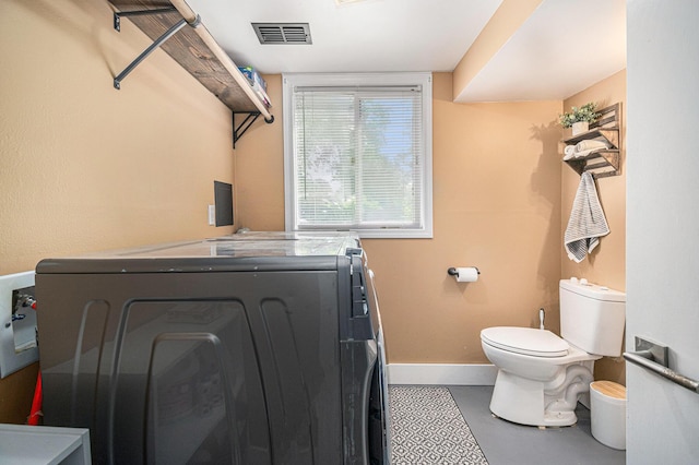 3042 Kevin St, Saint Joseph, MI 49085 - laundry area featuring baseboards and separate washer and dryer
