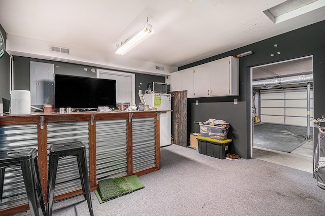 3042 Kevin St, Saint Joseph, MI 49085 - kitchen with white cabinets and refrigerator