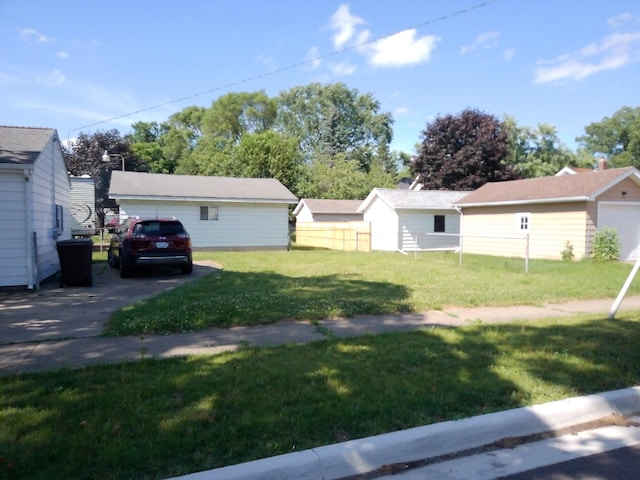 1602 Blakely Ave, Jackson, MI 49202 - view of green lawn with a detached garage
