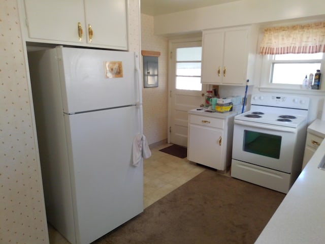 1602 Blakely Ave, Jackson, MI 49202 - kitchen with white appliances, white cabinetry, light countertops, and light floors