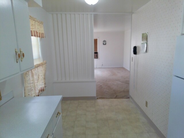 1602 Blakely Ave, Jackson, MI 49202 - hall with light flooring, light carpet, and wallpapered walls