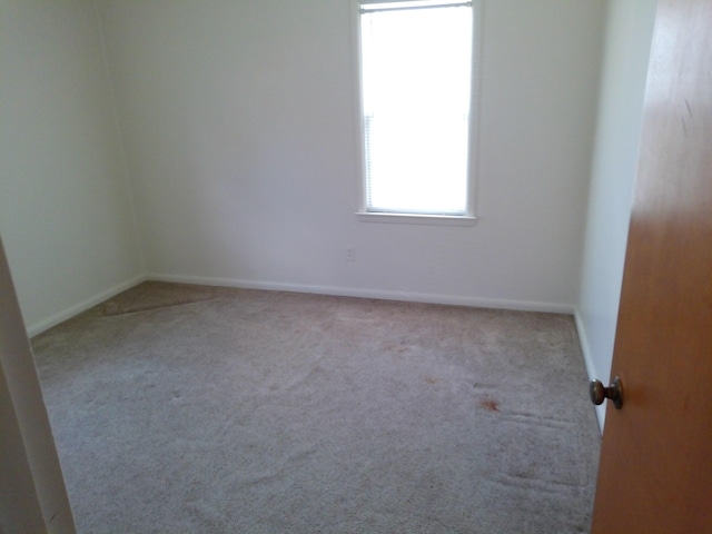 1602 Blakely Ave, Jackson, MI 49202 - carpeted spare room featuring baseboards
