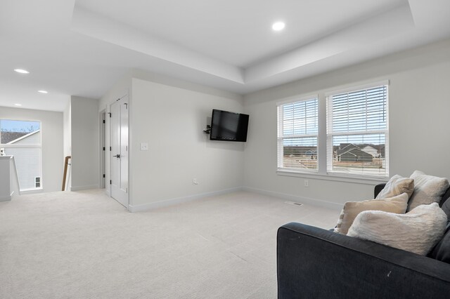 8114 Turning Stone, Kalamazoo, MI 49009 - living area with light colored carpet, healthy amount of natural light, recessed lighting, and a raised ceiling