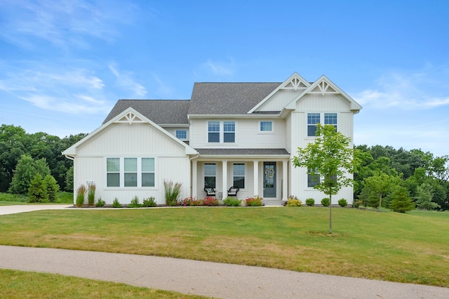 8114 Turning Stone, Kalamazoo, MI 49009 - craftsman house featuring covered porch, a front yard, and board and batten siding