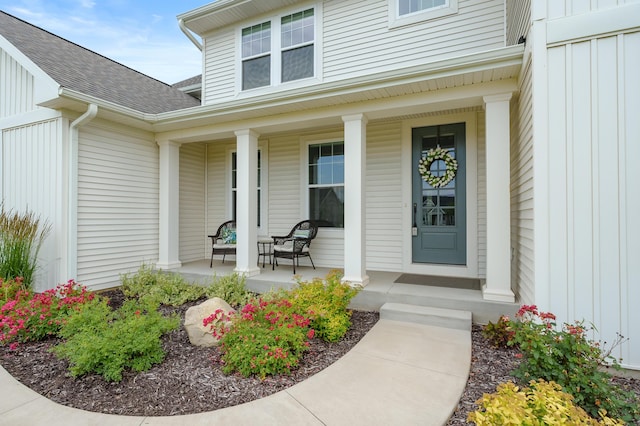 8114 Turning Stone, Kalamazoo, MI 49009 - view of exterior entry featuring a porch, board and batten siding, and a shingled roof