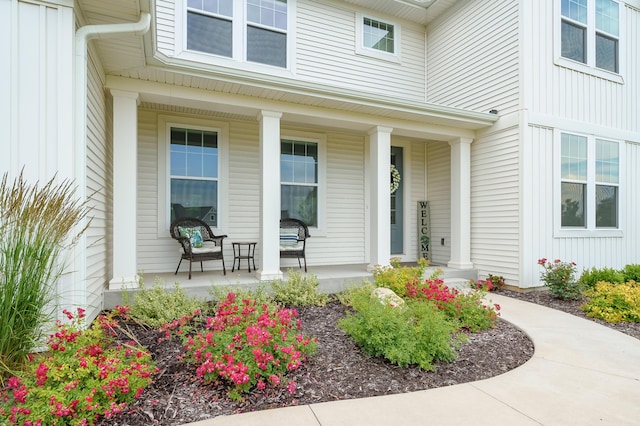 8114 Turning Stone, Kalamazoo, MI 49009 - view of exterior entry featuring a porch and board and batten siding