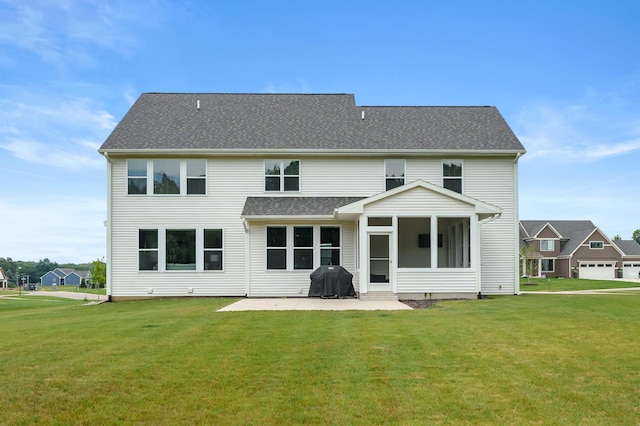 8114 Turning Stone, Kalamazoo, MI 49009 - back of property with a yard, a patio, and a sunroom