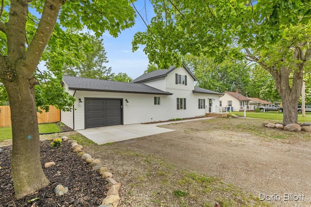 412 S Woodworth St, Corunna, MI 48817 - view of front of house with driveway, a garage, and roof with shingles