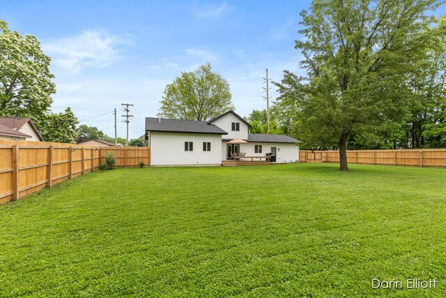 412 S Woodworth St, Corunna, MI 48817 - rear view of property with a fenced backyard and a wooden deck