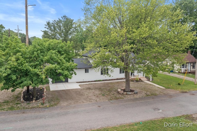 412 S Woodworth St, Corunna, MI 48817 - view of property hidden behind natural elements with driveway