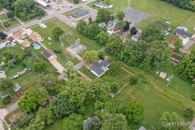 412 S Woodworth St, Corunna, MI 48817 - aerial overview of property's location featuring a tree filled landscape