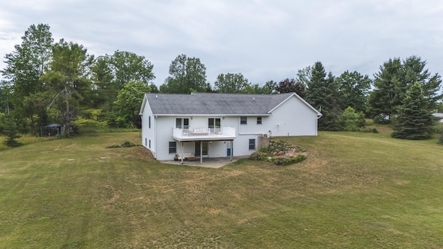 1684 W W County Line Rd, Sand Lake, MI 49343 - back of house featuring a patio area, a lawn, and a deck