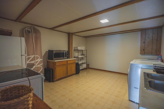 1684 W W County Line Rd, Sand Lake, MI 49343 - washroom featuring light flooring and washer / dryer