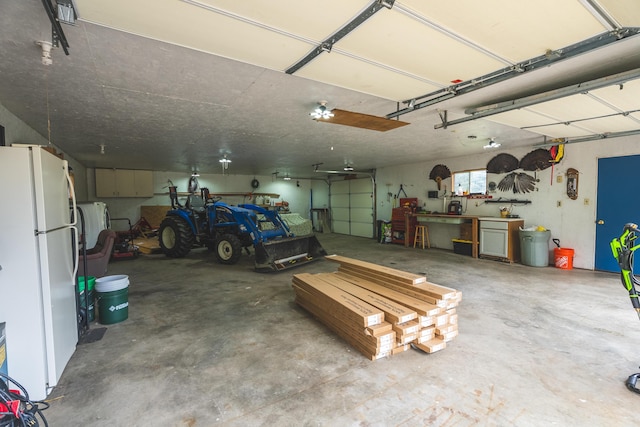 1684 W W County Line Rd, Sand Lake, MI 49343 - garage with freestanding refrigerator