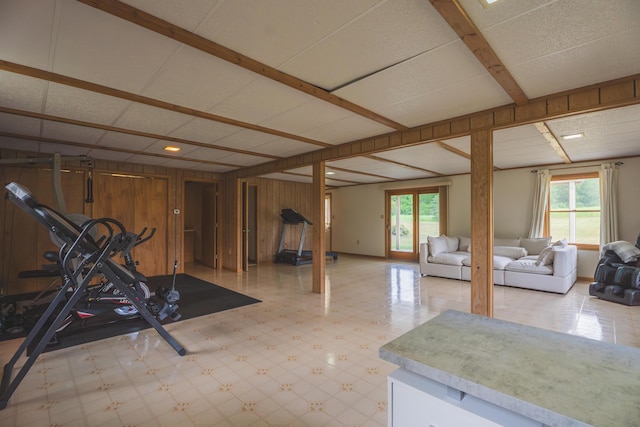 1684 W W County Line Rd, Sand Lake, MI 49343 - basement featuring light flooring, plenty of natural light, and wooden walls