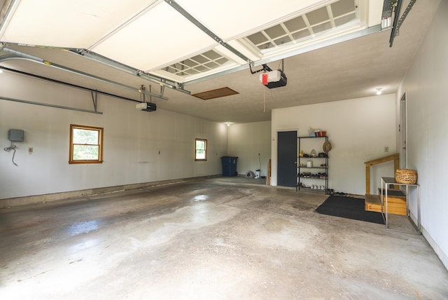 1684 W W County Line Rd, Sand Lake, MI 49343 - garage with a garage door opener
